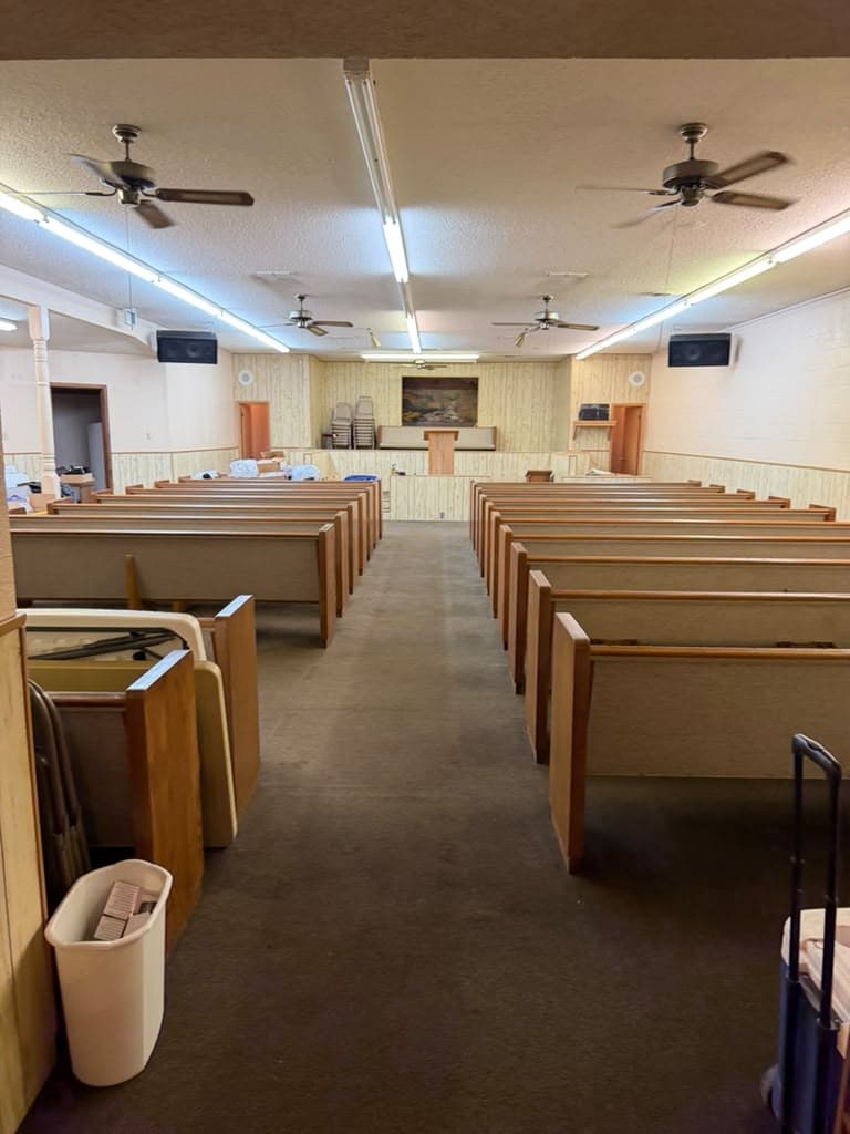 The main hall of the building, pews still in place
